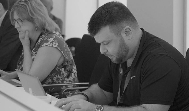 event attendee working on laptop